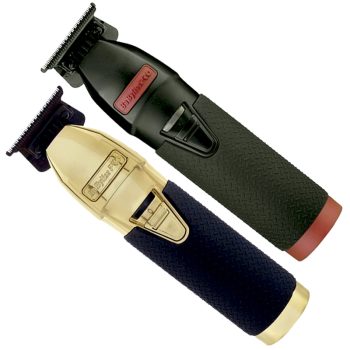 Par de recortadoras inalámbricas tipo T dispuestas en diagonal, una con carcasa negra y empuñadura texturizada con detalle rojo y otra con acabado dorado y mango azul oscuro texturizado, ambas con cuchillas de precisión metálicas visibles que sugieren diseño ergonómico y alta calidad.