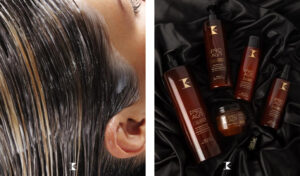 Primer plano de cabello húmedo con producto aplicado junto a un set de envases y tarros marrones sobre tela negra, sugiriendo un tratamiento capilar profesional.