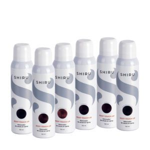 Seis botes blancos de spray retocador de raíces de la marca SHIRU en distintos tonos sobre fondo blanco, destinados a uso en peluquería.