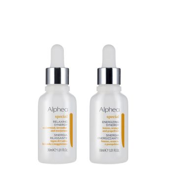 Dos frascos esmerilados de 30 ml con cuentagotas plateado y etiquetas minimalistas colocados lado a lado sobre fondo blanco, presentando un contraste limpio que los hace aptos para uso en peluquería.