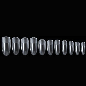 Juego de uñas postizas transparentes en distintas tallas, alineadas de mayor a menor sobre fondo negro, ideales para peluquería; consultar precio.