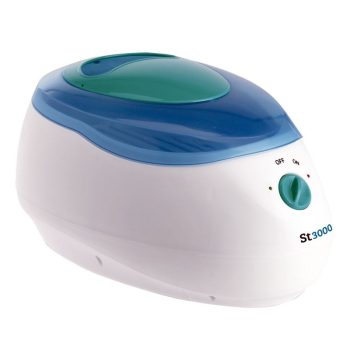 Aparato calentador compacto de plástico blanco con tapa superior azul y verde translúcida, mando giratorio y luces indicadoras, indicado para peluquería y disponible.