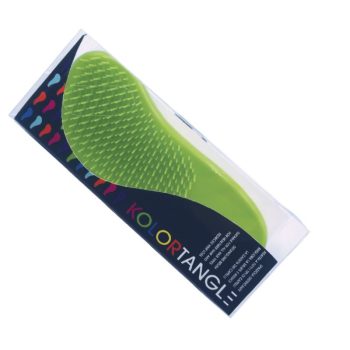 Cepillo desenredante verde dentro de envase plástico transparente sobre una tarjeta oscura con motivos coloridos, destinado a peluquería y con aspecto de alta calidad