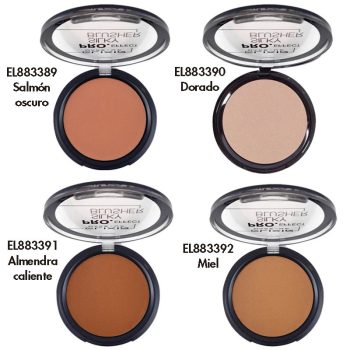 Cuatro polvos compactos de maquillaje abiertos en envases redondos con tapa transparente, presentados en tonos salmón oscuro, dorado, almendra cálida y miel, con la palabra PRO visible en las tapas que sugiere uso profesional.