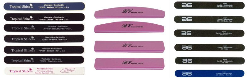 Varias limas de uñas alineadas en tres columnas con formas rectas, curvas y de bloque en colores negro, rosa, blanco y azul, mostrando superficies abrasivas y marcaje de granos para uso en manicura por profesionales.