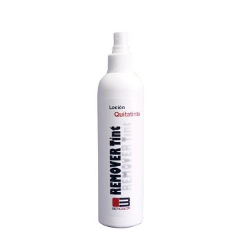 Botella blanca con atomizador y etiqueta que indica "Loción Quitatinte" y "Remover Tint", con diseño minimalista y aspecto profesional.