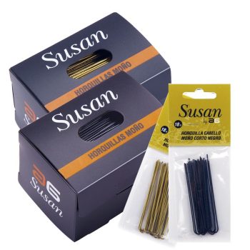 Cajas y blísteres de horquillas para cabello de la marca Susan con horquillas doradas y negras visibles en embalaje comercial que transmite alta calidad.