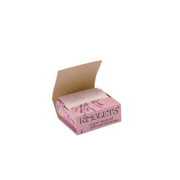 Caja rosa abierta de papel especial para permanentes con hojas finas apiladas, diseñada para uso 'profesional' en salones de belleza.
