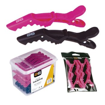 Pinzas tipo cocodrilo para el cabello en colores rosa y negro, mostradas sueltas y en dos presentaciones empaquetadas en caja y bolsa transparentes, apropiadas para uso en peluquería.