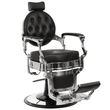 Elegante silla de barbero vintage en cuero negro con respaldo redondo capitoné, reposacabezas ajustable, brazos y base cromados y reposapiés hidráulico, diseñada para uso 'profesional'.
