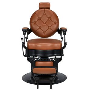 Silla de barbero clásica de cuero marrón con respaldo redondo capitoné, reposacabezas, reposabrazos y reposapiés integrados en estructura metálica negra sobre base circular, apta para una 'peluquería'.