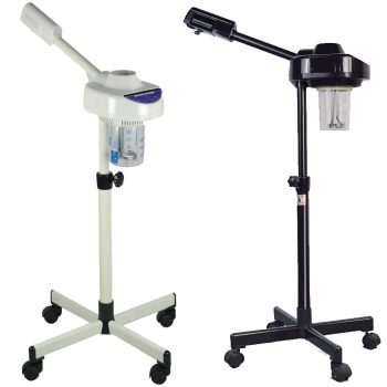 Dos vaporizadores faciales móviles sobre soportes con base de cuatro ruedas, uno blanco y otro negro, con brazos articulados y recipientes transparentes para tratamientos en salón de belleza.